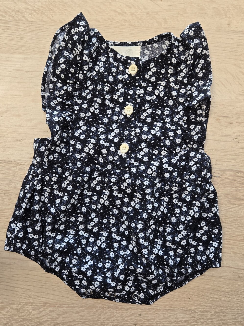 Three Peas Boutique Black Floral Ruffle Baby Romper